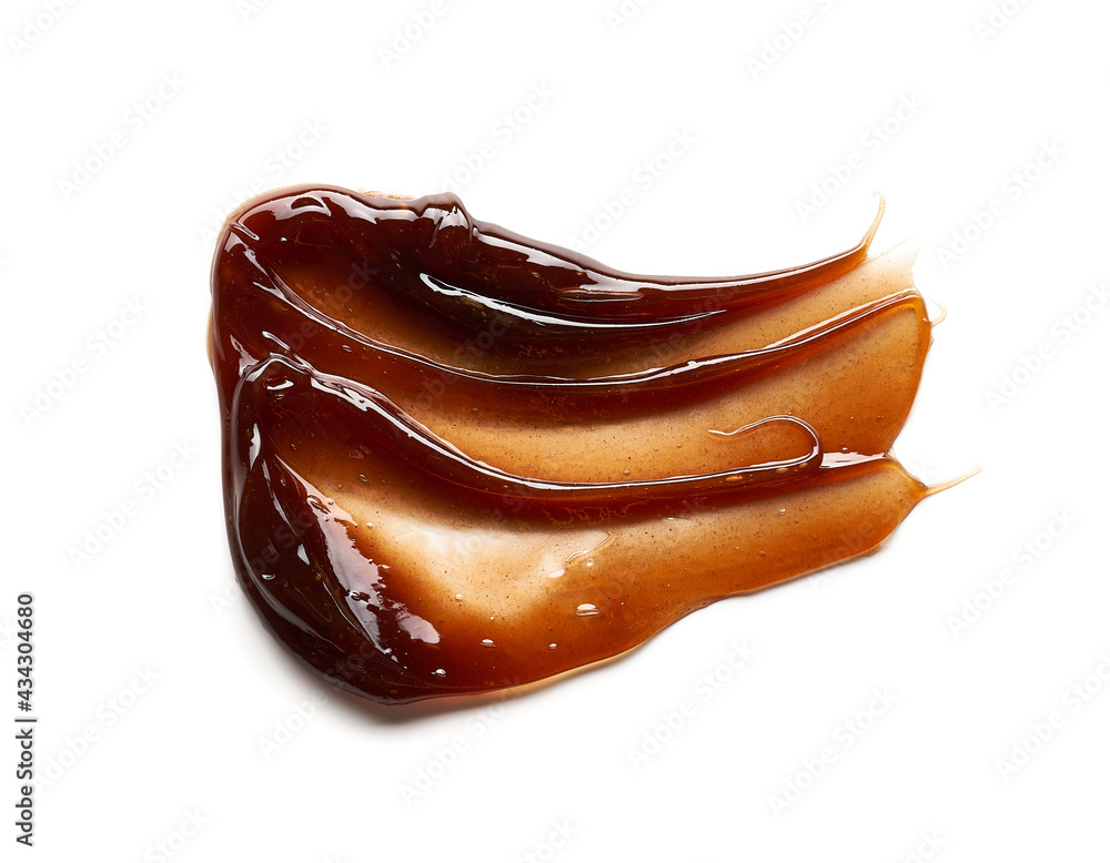 Chocolate colored gel smear and texture. Cosmetic gel or caramel syrup on white background Chocolate colored gel smear and texture. Cosmetic gel or caramel syrup on white background