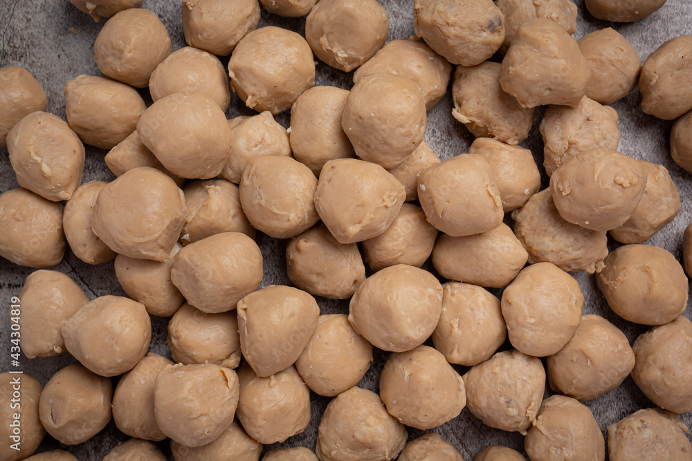 Beef ball fried on the dark wooden background. Beef ball fried on the dark wooden background.