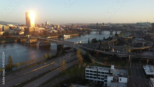 Cinematic aerial drone shot of Portland Pearl and Lloyd Districts, East Portland, Buckman Neighborhood, waterfront, Willamette River, Tom McCall Waterfront Park, skyscrapers and cityscape in Oregon photo