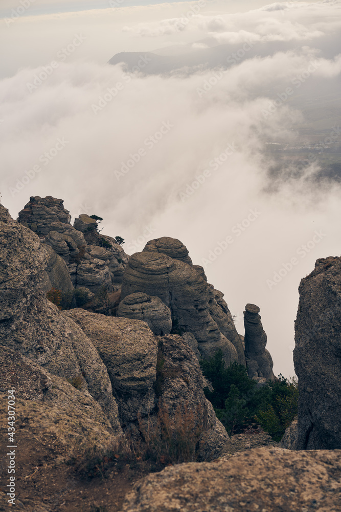 Grand stone pillars on the slopes of Mount Demerdzhi. Valley of ghosts, Crimean Mountains. Grand stone pillars on the slopes of Mount Demerdzhi. Valley of ghosts, Crimean Mountains.