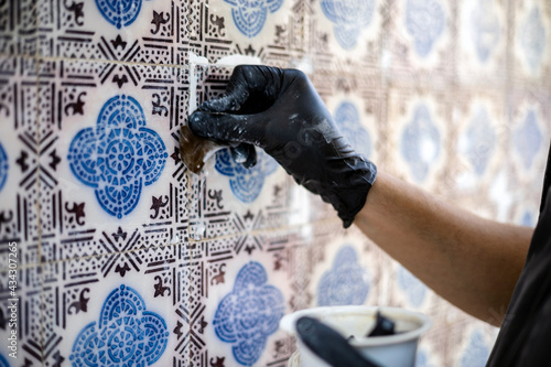 Restoring the beauty of vintage tile azulejos on the facade of old house