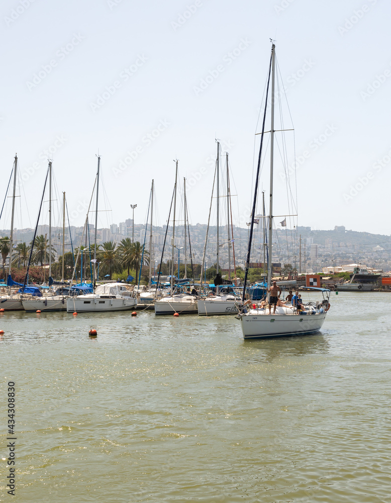 Obraz premium Berth parking with a large number of yachts in the Mediterranean Sea at the port of Haifa in Israel