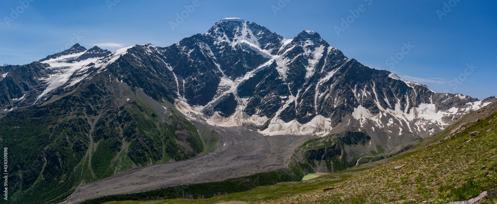 Glacier Seven on mount Donguzorun. Panoramic view from Cheget mount, Kabardino Balkaria region. Russia. 3000 metres height. Lifting on Cable Car. View on Donguzorun peak on left and Nakratau peak on - obrazy, fototapety, plakaty 