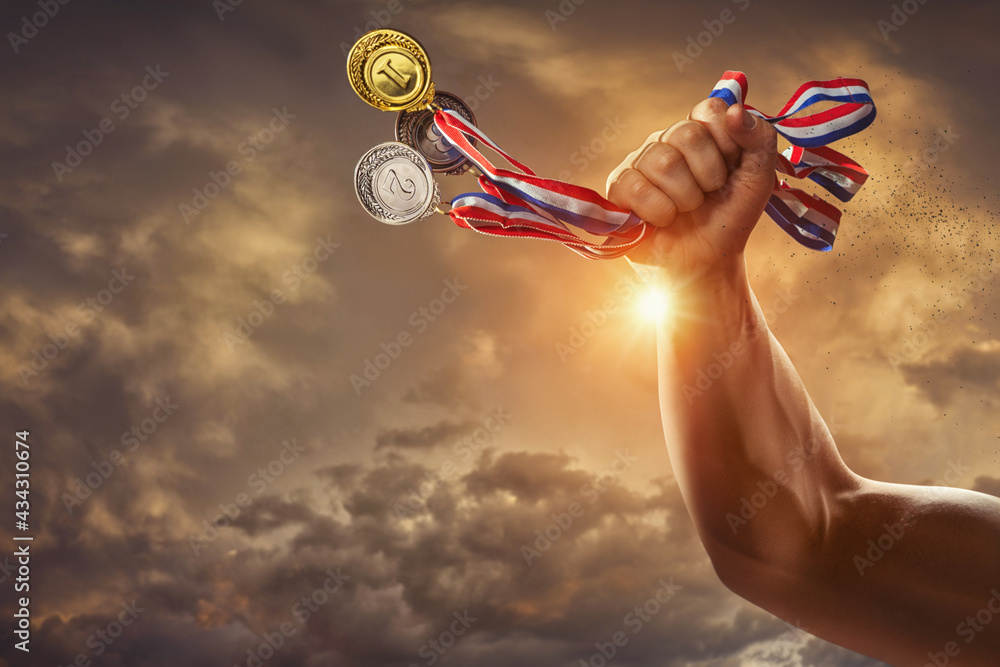 different medals in hand - Victory Concept - obrazy, fototapety, plakaty 