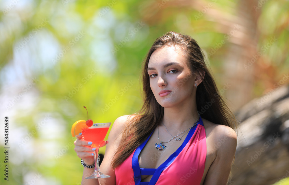 beautiful girl in bikini with a glass of cocktail at sea tropical resort beautiful girl in bikini with a glass of cocktail at sea tropical resort