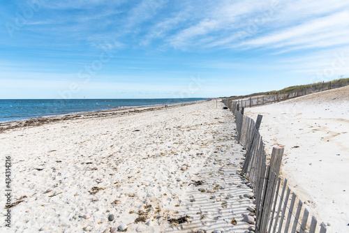 Deserted sandy beach and blue ocean on a sunny autumn day. Cape Cod  MA  USA 