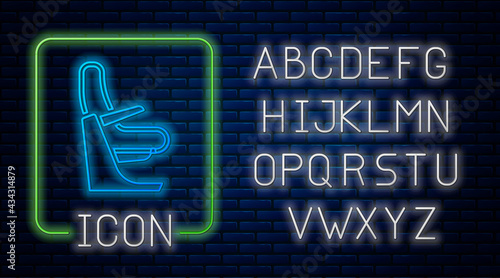 Glowing neon Airplane seat icon isolated on brick wall background. Neon light alphabet. Vector