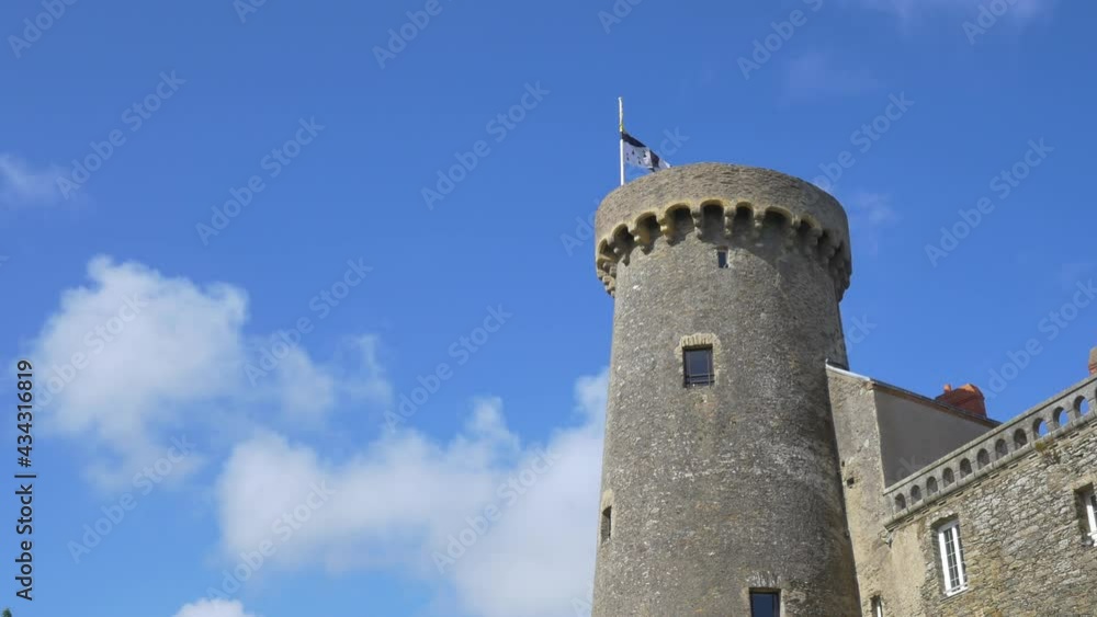 view of tower at castle of blue beard in Pornic, Loire Atlantique, France, 9 may 2021. The tower and spire of Château de Pornic against clear sunset sky of Brittany. romantic Travel destinations view of tower at castle of blue beard in Pornic, Loire Atlantique, France, 9 may 2021. The tower and spire of Château de Pornic against clear sunset sky of Brittany. romantic Travel destinations