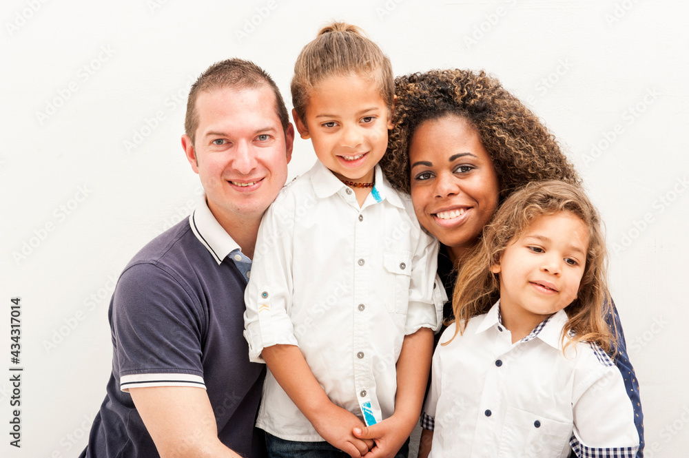Happy multiracial family with two children, on the white background Happy multiracial family with two children, on the white background