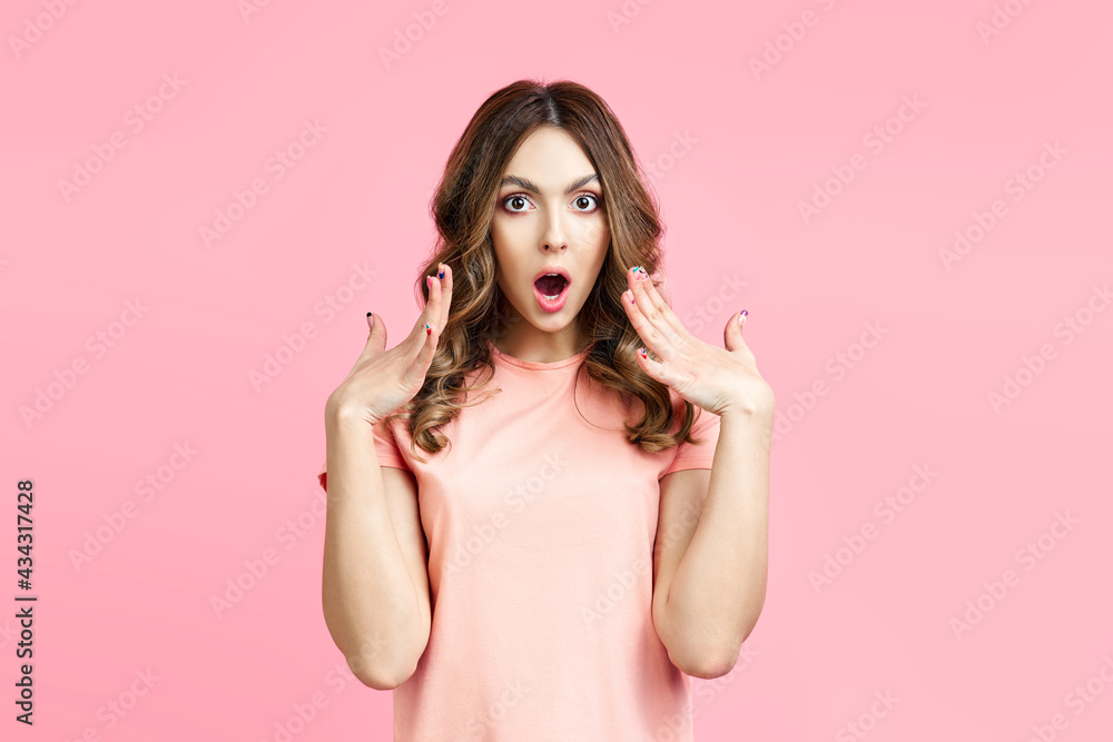 Portrait of amazed surprised woman on pink background Portrait of amazed surprised woman on pink background