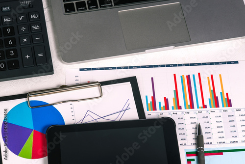 Work desk with accounting documents, calculator and graphs. Analysis and analytics of the company's activities. Budget planning, audit and tax calculation. Loan issuance concept