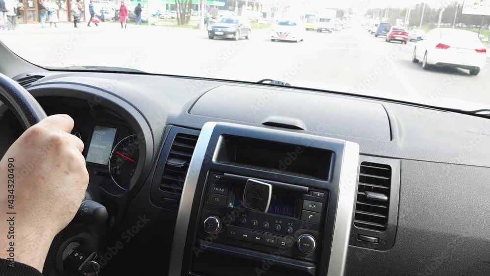 man driving car view from inside steering wheel dashboard man driving car view from inside steering wheel dashboard