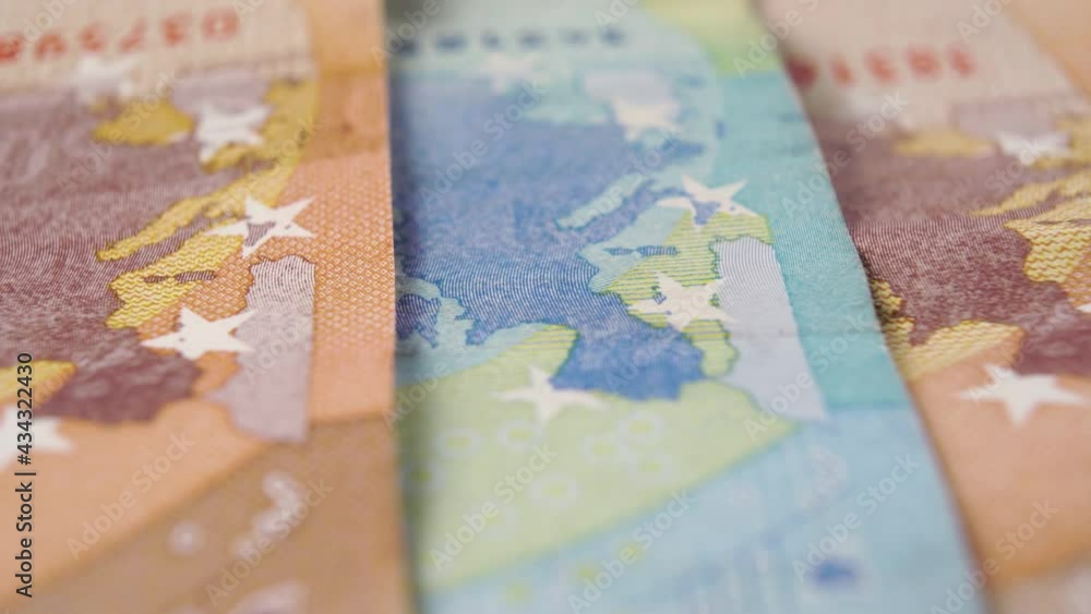 Euro banknotes with European Union map with stars on paper cash extreme close up. Macro. Dolly shot. Euro banknotes with European Union map with stars on paper cash extreme close up. Macro. Dolly shot.