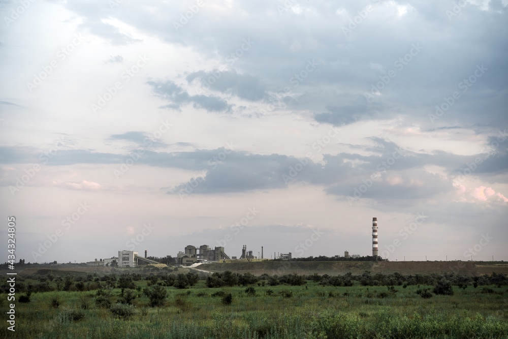 old plant factory in distance. landscape with industrial building and pipe old plant factory in distance. landscape with industrial building and pipe