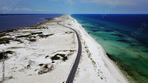 Aerial view of a white sand beach in florida with a road