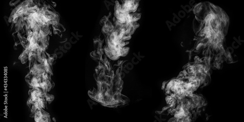 A perfect set of three different mystical curly white steam or smoke on a black background. Abstract background