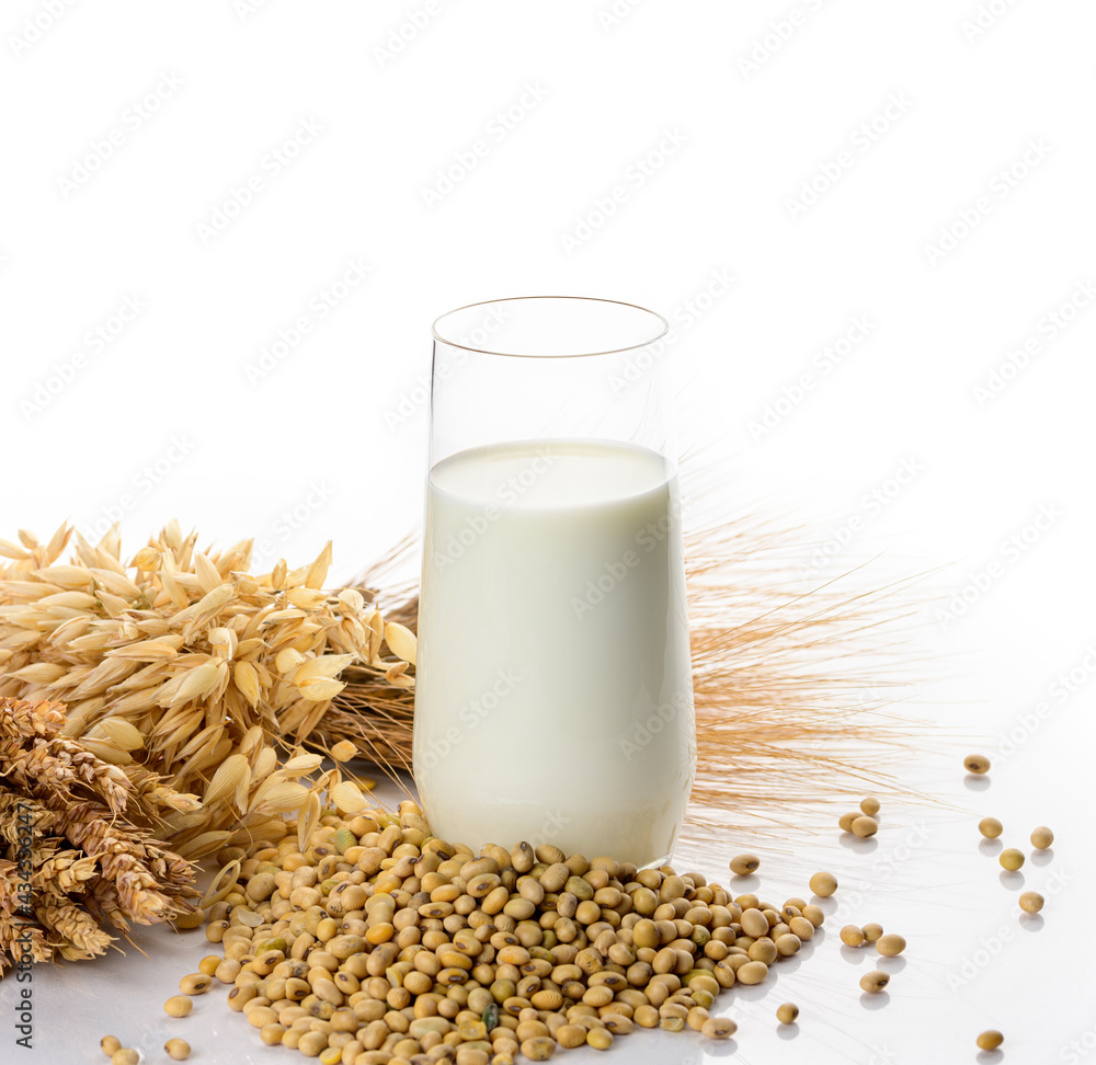 Vegan soy milk, rice milk, oat milk, dairy-free alternative milk. Soybeans and ears of cereals. Vegan soy milk, rice milk, oat milk, dairy-free alternative milk. Soybeans and ears of cereals.