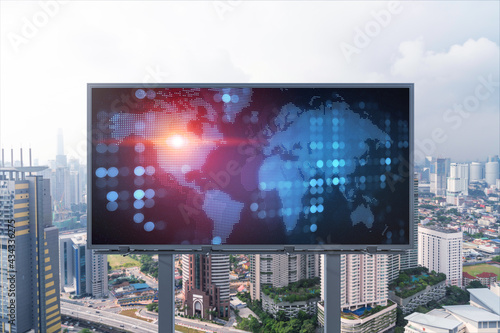 World planet Earth map hologram on billboard over panorama city view of Kuala Lumpur, Malaysia, Asia. The concept of international connections and business.