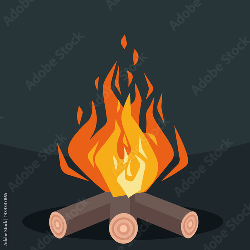 Bonfire on a dark background. Fire sparks. Leisure at the camp.