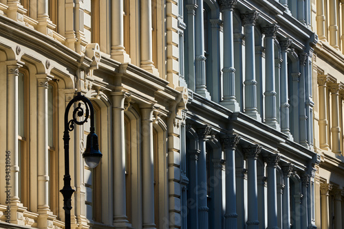 Typical building facades in SoHo, the Cast Iron Historic District with distinct late 19th century architecture. Lower Manhattan, New York City, USA