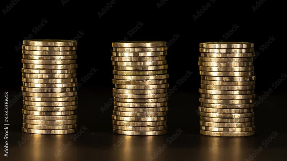 4K Stop motion shows the stack of three piles of gold cash coins decreasing and increase fading disappear from below with Key frame technique at black background, business and financial trading
conce 4K Stop motion shows the stack of three piles of gold cash coins decreasing and increase fading disappear from below with Key frame technique at black background, business and financial trading
conce