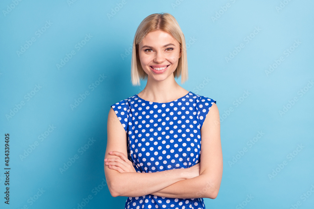 Fototapeta premium Photo of young cheerful girl happy positive smile confident folded hands isolated over blue color background