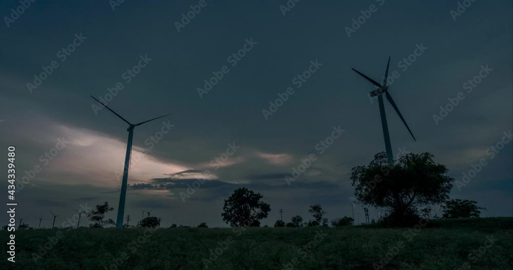 Scenic View Of Wind Turbines On Rural Landscape At Dusk In Gujarat, India. - Timelapse Scenic View Of Wind Turbines On Rural Landscape At Dusk In Gujarat, India. - Timelapse