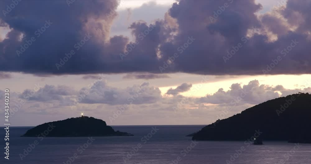 Clouds over the sea at sunset with island and lighthouse.Timelapse in the Ligurian sea with the lighthouse of the island of Tino, near the Cinque Terre. La Spezia, near Cinque Terre, Liguria, Italy.
Clouds over the sea at sunset with island and lighthouse.Timelapse in the Ligurian sea with the lighthouse of the island of Tino, near the Cinque Terre. La Spezia, near Cinque Terre, Liguria, Italy.