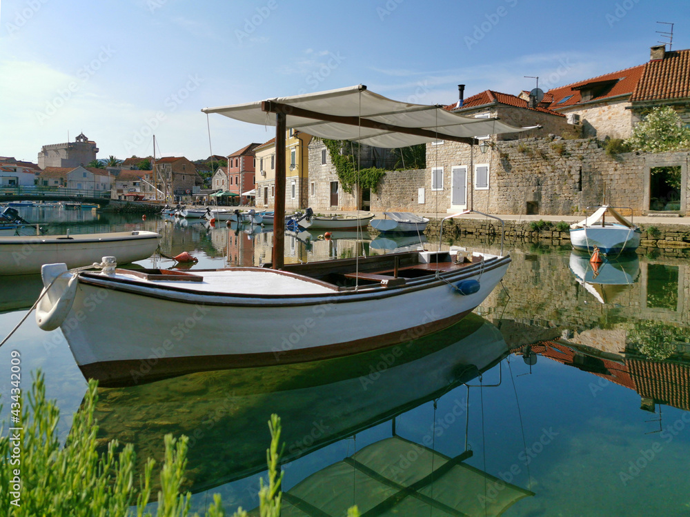 Fisherman boat on the Canal in the harbor of Vrboska, Hvar island, Croatia