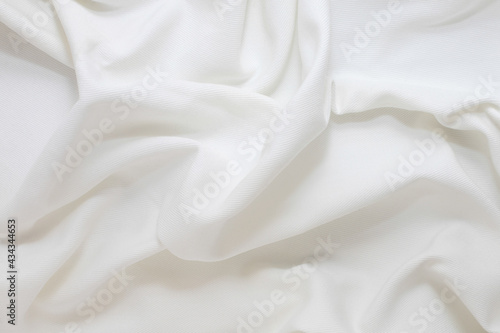 Texture of wrinkled, crumpled ivory fabric close-up. background for your mockup