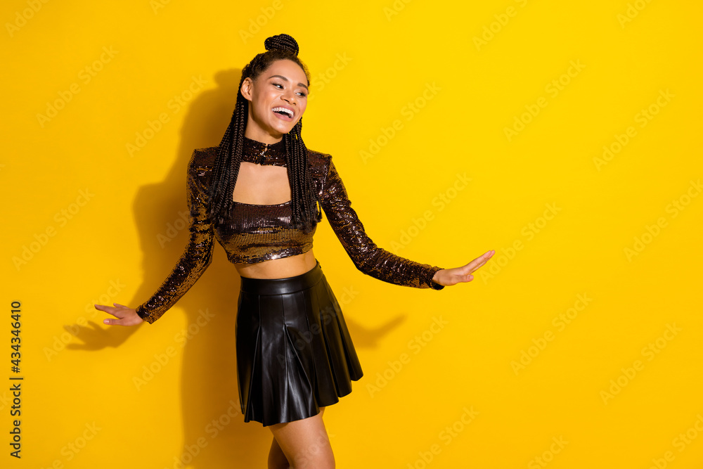 Photo of young cheerful afro girl happy positive smile excited look empty space isolated over yellow color background