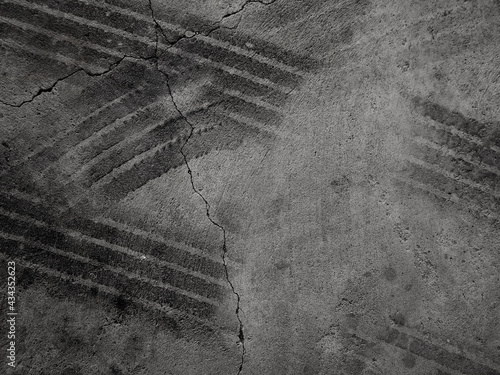 Close up black tire marks on cement floor photo