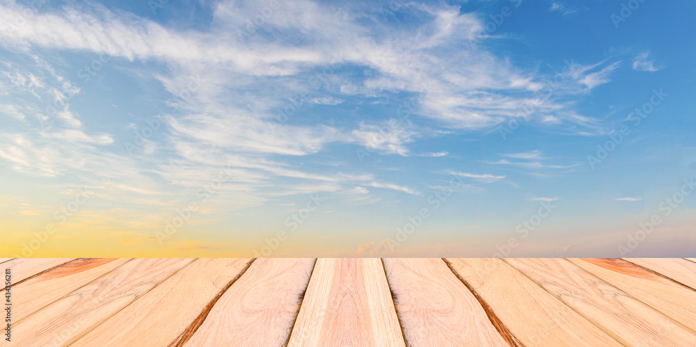 Natural wood planks and blue sky background