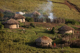 Masai village in Ngorongoro crater. Small Masai huts in African savanna, Tanzania.