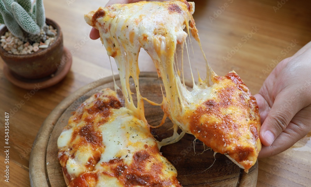 A slice of hot pizza with stretchy cheese, Slice of fresh italian