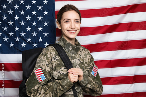 Photos Female cadet with backpack against American flag