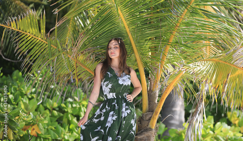 girl in a dress at a tropical resort