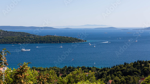 View of the sea bay near Trogir in Croatia from a mountain road. Many yachts move on the sea