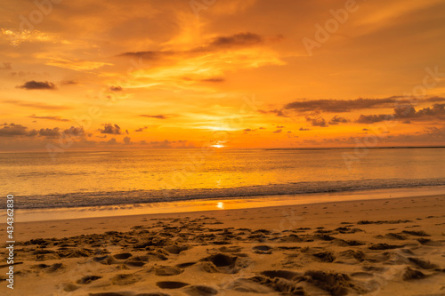 Calm sea with sunset sky and sun through the clouds over. Meditation ocean and sky background. Tranquil seascape. Horizon over the water. in Phuket Thailand.