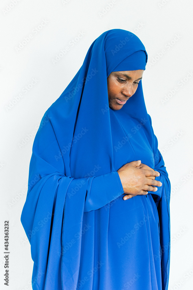 Muslim woman in prayer at home Muslim woman in prayer at home