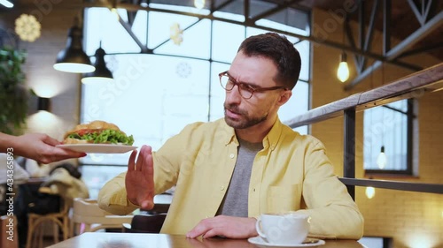 the guy is disappointed with stale and tasteless food in the restaurant and complains to the waiter