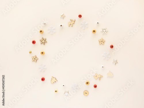 Christmas card with red, silver and golden decorations over white background. Flat lay, top view, copy space. Christmas Circle shaped border