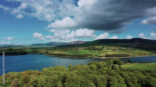 Nature before the storm. Aerial view over Irish landscape in spring on a cloudy day. 