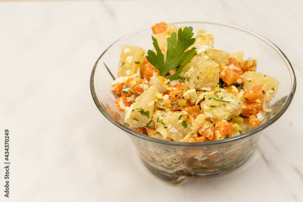 Delicious natural salad of cassava, carrot, egg with olive oil, ideal as a side dish. Normal view. Natural nutrition concept. Delicious natural salad of cassava, carrot, egg with olive oil, ideal as a side dish. Normal view. Natural nutrition concept.