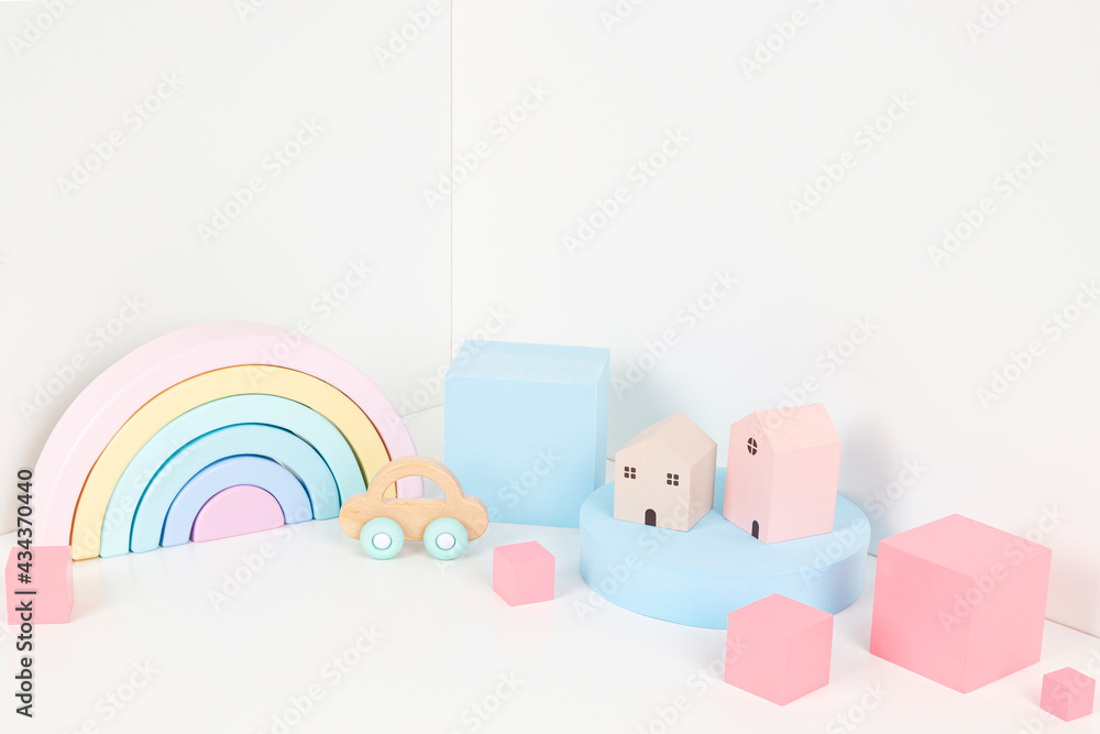 Composition of colorful educational baby kid toys and geometric shapes podium, platform on white background Composition of colorful educational baby kid toys and geometric shapes podium, platform on white background