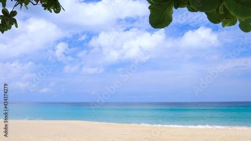 Phuket tropical beach in the tourist season of Thailand on a sunny day. The horizon and clouds can be seen clearly.