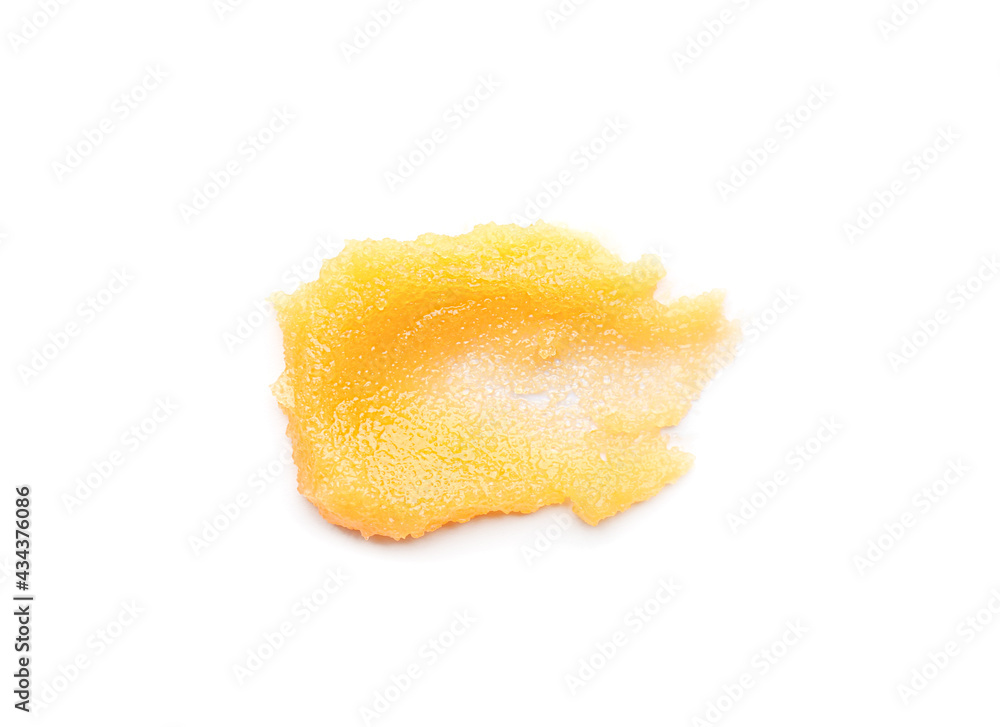 Smear of orange body scrub isolated on white, top view Smear of orange body scrub isolated on white, top view