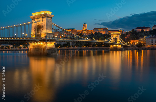 Beautiful evening view of Chain Bridge with the Royal Palace in background in Budapest  Hungary  Europe