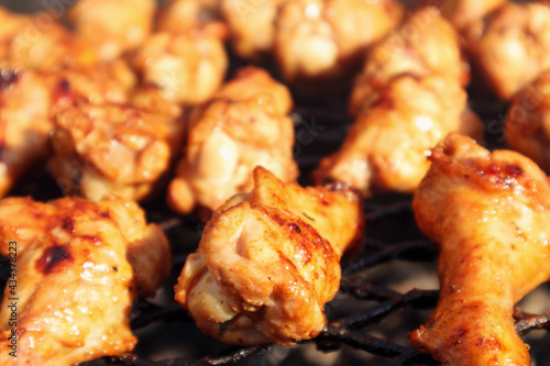 Close-up of grilled chicken half-wings, selective focus