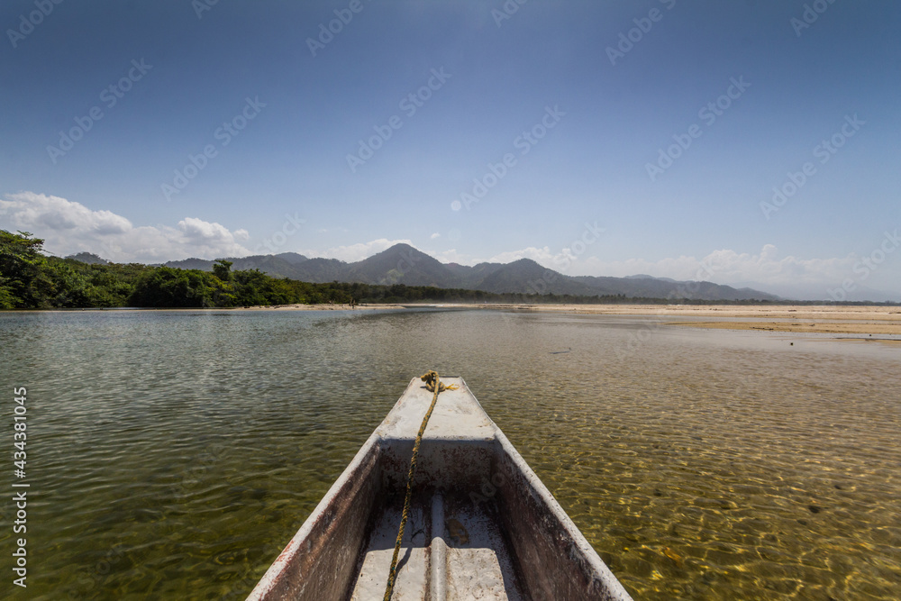Naklejka premium canoe on the river